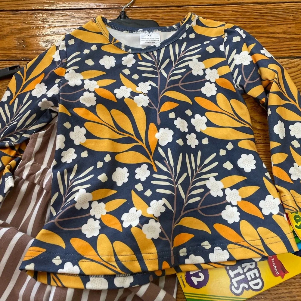 Girls striped toddler’s overalls with floral top.  Size XS (2T). No brand.